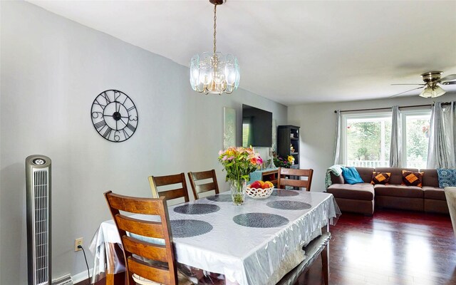 52 Old Chester Rd, Goshen, NY 10924 - dining area with dark wood-style floors, a chandelier, ceiling fan, and a heating unit