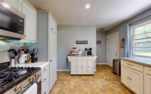 52 Old Chester Rd, Goshen, NY 10924 - kitchen with stainless steel appliances, stone finish flooring, baseboards, light countertops, and recessed lighting