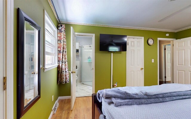 52 Old Chester Rd, Goshen, NY 10924 - bedroom with light wood-style floors, connected bathroom, and baseboards