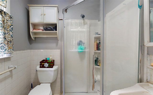 52 Old Chester Rd, Goshen, NY 10924 - bathroom with a shower stall, toilet, tile walls, and a wainscoted wall