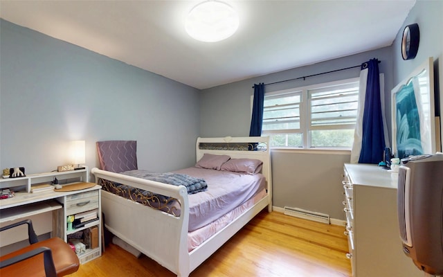 52 Old Chester Rd, Goshen, NY 10924 - bedroom featuring light wood finished floors, a baseboard heating unit, and baseboards