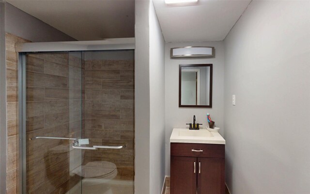 52 Old Chester Rd, Goshen, NY 10924 - bathroom with vanity, toilet, and a shower stall