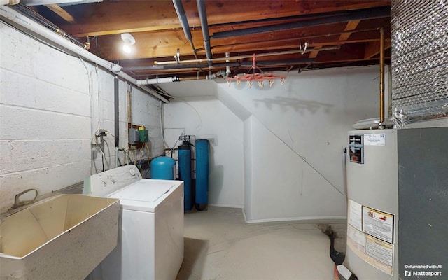 52 Old Chester Rd, Goshen, NY 10924 - unfinished basement with washer / clothes dryer, a sink, water heater, and a water pressure tank