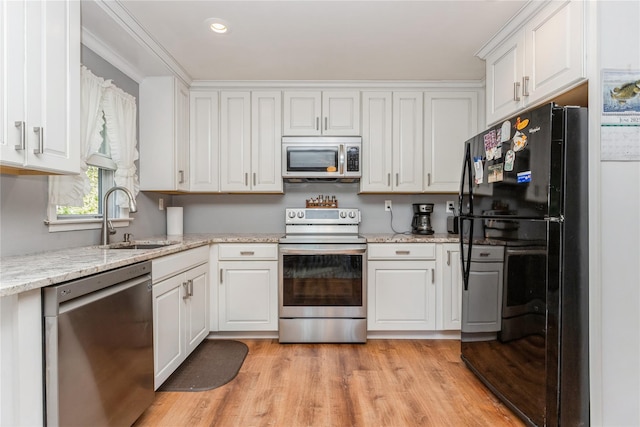 37 Old Mill Rd, Yorktown Heights, NY 10598 - kitchen with stainless steel appliances, white cabinets, light wood-style flooring, light stone counters, and recessed lighting