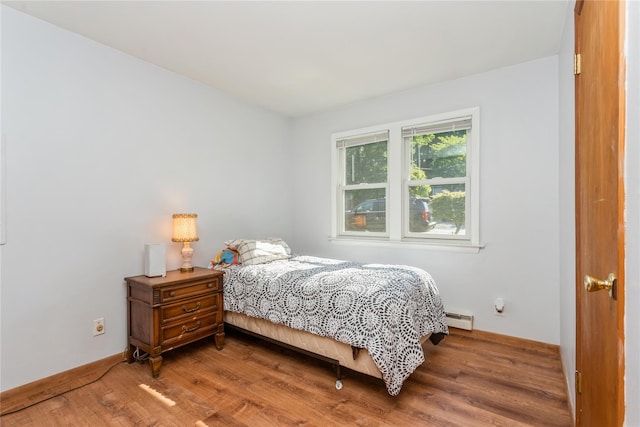 37 Old Mill Rd, Yorktown Heights, NY 10598 - bedroom featuring baseboard heating and wood finished floors