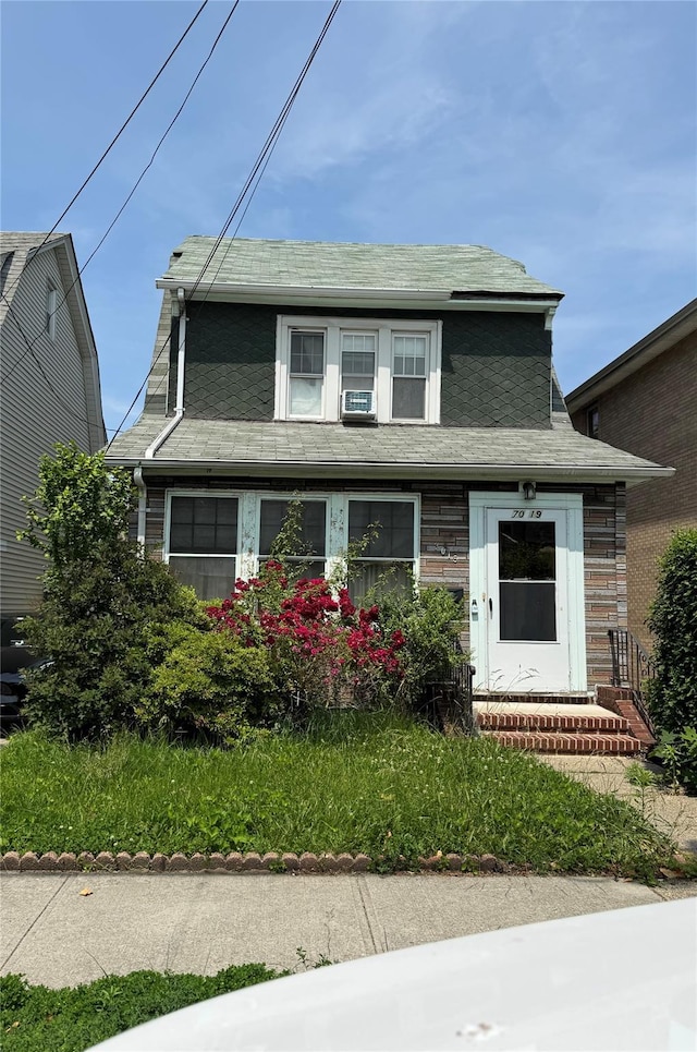 70-19 Manse St, Forest Hills, NY 11375 - view of front of property with cooling unit and a shingled roof