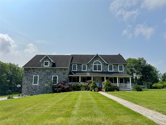 10 Wyllys Ct, Rock Tavern, NY 12575 - colonial house featuring stone siding, covered porch, and a front yard