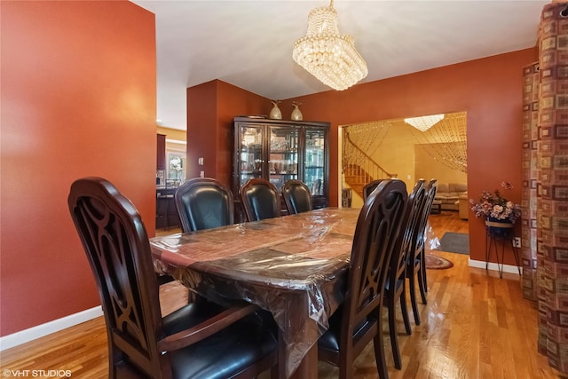 10 Wyllys Ct, Rock Tavern, NY 12575 - dining room with wood finished floors and a chandelier