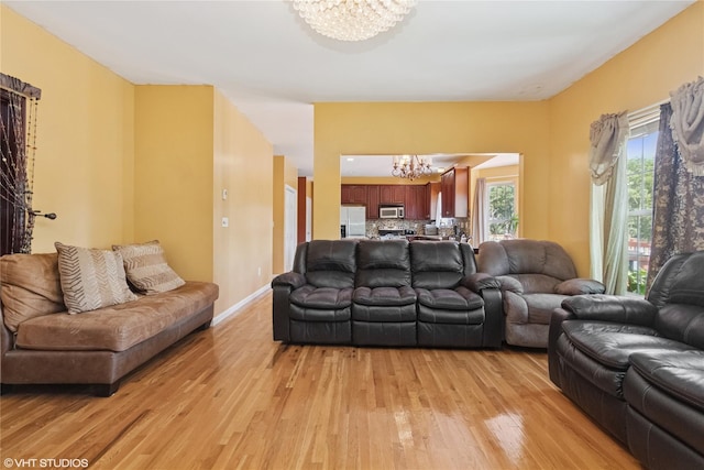10 Wyllys Ct, Rock Tavern, NY 12575 - living room featuring a chandelier and light wood finished floors