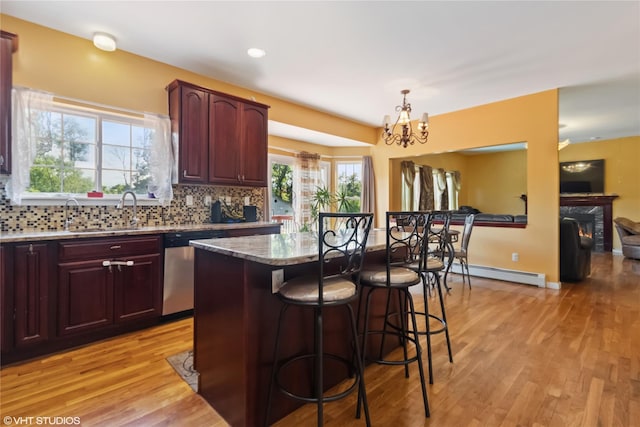 10 Wyllys Ct, Rock Tavern, NY 12575 - kitchen featuring baseboard heating, stainless steel dishwasher, a chandelier, light wood-type flooring, and recessed lighting