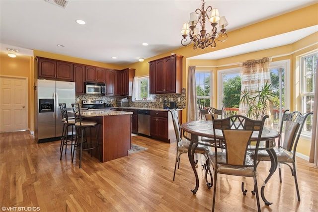 10 Wyllys Ct, Rock Tavern, NY 12575 - kitchen with stainless steel appliances, healthy amount of natural light, a kitchen island, decorative backsplash, and recessed lighting