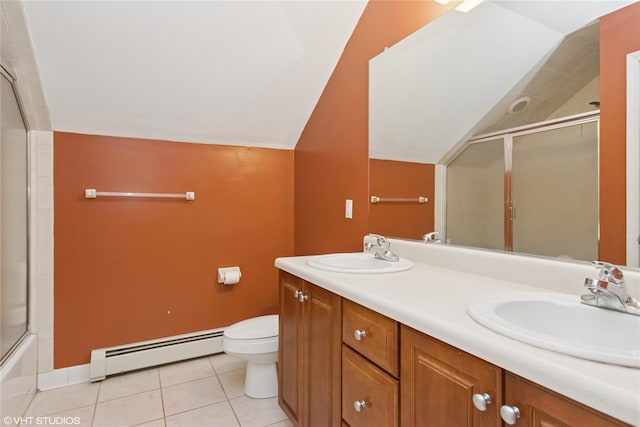 10 Wyllys Ct, Rock Tavern, NY 12575 - full bathroom featuring baseboard heating, vaulted ceiling, tile patterned flooring, and double vanity