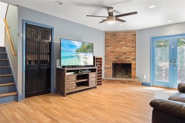 32 Overhill Rd, Yorktown Heights, NY 10598 - living area with stairway, light wood-style flooring, a ceiling fan, a fireplace, and recessed lighting