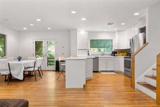 32 Overhill Rd, Yorktown Heights, NY 10598 - kitchen featuring appliances with stainless steel finishes, healthy amount of natural light, white cabinetry, and recessed lighting