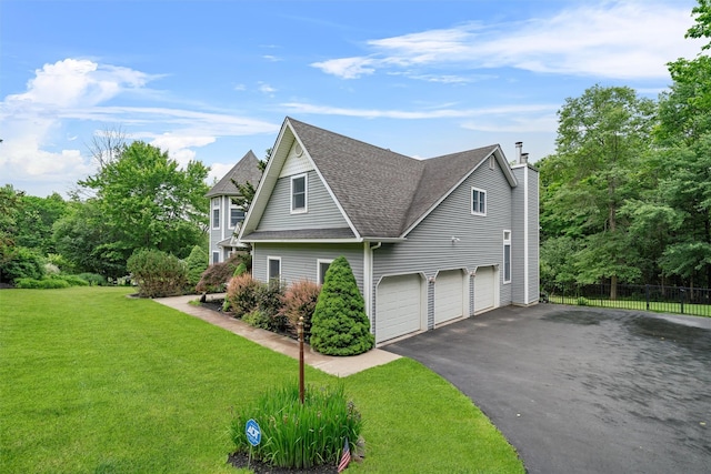32 Woodcrest Ln, Goshen, NY 10924 - view of property exterior featuring asphalt driveway, a chimney, roof with shingles, and an attached garage