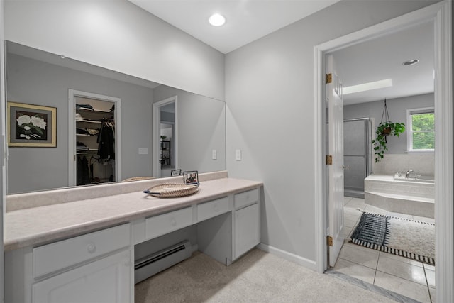 32 Woodcrest Ln, Goshen, NY 10924 - full bathroom featuring a baseboard heating unit, vanity, a bath, a stall shower, and a spacious closet