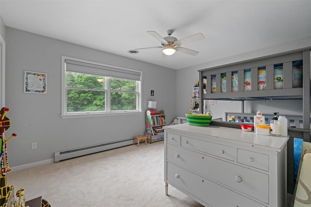 32 Woodcrest Ln, Goshen, NY 10924 - bedroom with a baseboard radiator, light carpet, ceiling fan, and baseboards
