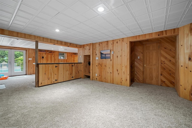 32 Woodcrest Ln, Goshen, NY 10924 - unfurnished living room featuring carpet floors, wood walls, and recessed lighting
