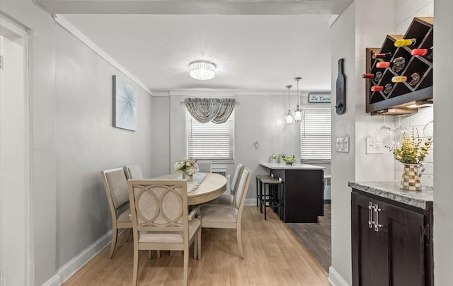 155-03 79th St Unit 188, Howard Beach, NY 11414 - dining room with light wood finished floors, ornamental molding, and baseboards