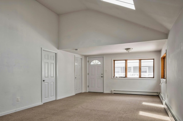 28 New Hampshire St, Long Beach, NY 11561 - foyer entrance with baseboard heating, carpet floors, high vaulted ceiling, and baseboards
