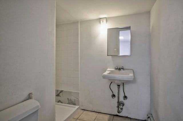 28 New Hampshire St, Long Beach, NY 11561 - full bathroom featuring toilet, tiled shower, and tile patterned floors