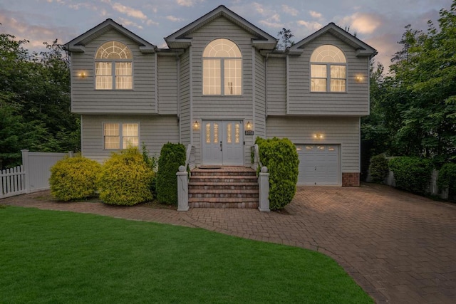 361 Locust Pl, Freeport, NY 11520 - view of front of house featuring a garage and decorative driveway