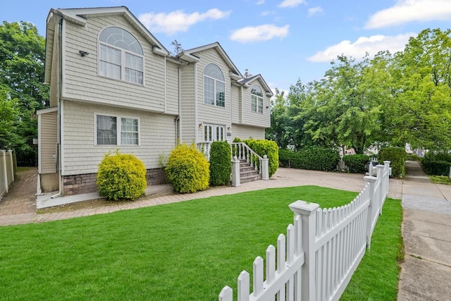 361 Locust Pl, Freeport, NY 11520 - view of front of home with a fenced front yard