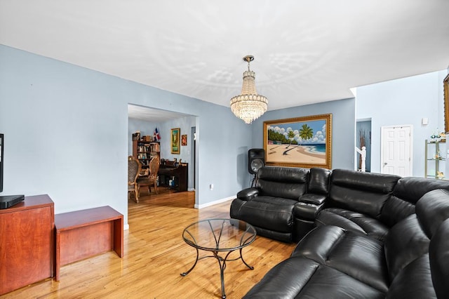 361 Locust Pl, Freeport, NY 11520 - living room featuring a chandelier and light wood finished floors
