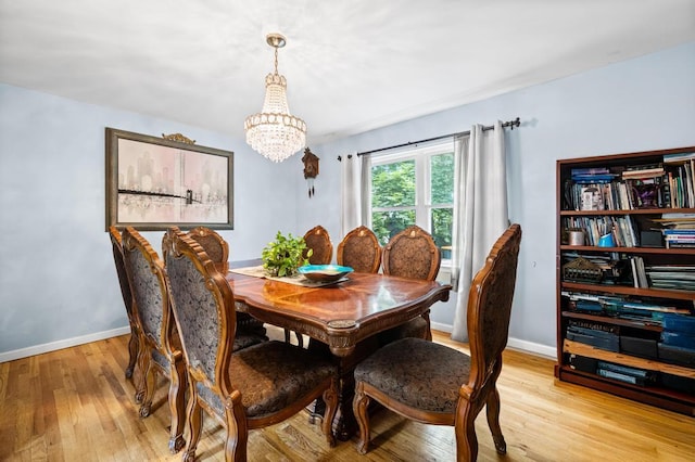 361 Locust Pl, Freeport, NY 11520 - dining space featuring a chandelier and light wood-style flooring