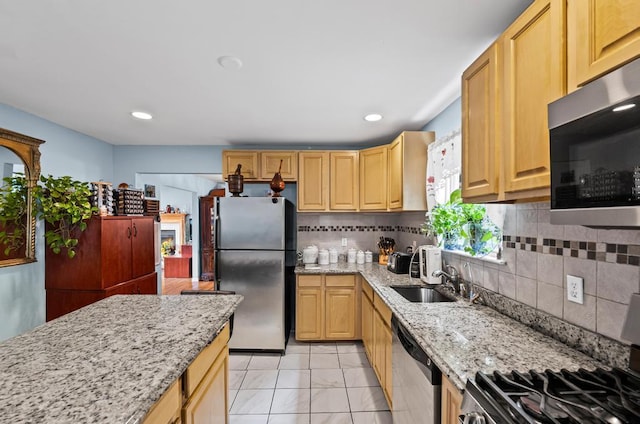 361 Locust Pl, Freeport, NY 11520 - kitchen with stainless steel appliances, tasteful backsplash, light stone countertops, and recessed lighting
