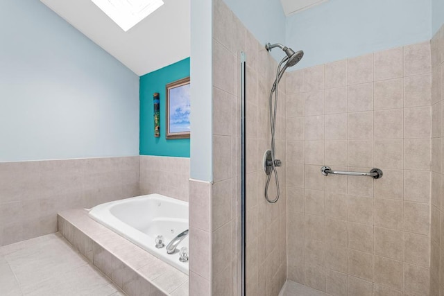 361 Locust Pl, Freeport, NY 11520 - bathroom with a stall shower, a garden tub, and lofted ceiling