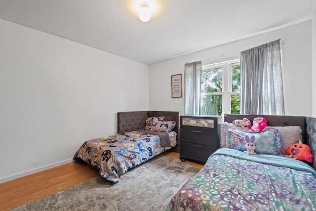 361 Locust Pl, Freeport, NY 11520 - bedroom with wood finished floors and baseboards