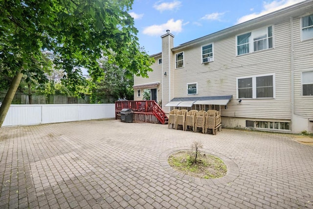 361 Locust Pl, Freeport, NY 11520 - rear view of property with a patio, a deck, and a chimney