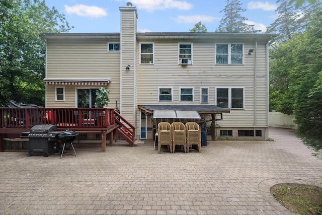 361 Locust Pl, Freeport, NY 11520 - back of house featuring a deck, a chimney, and a patio