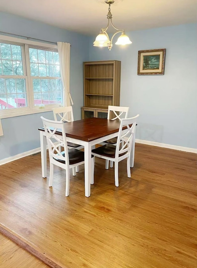 3 Chappell Pkwy, Middletown, NY 10940 - dining area featuring light wood-style floors, baseboards, and a chandelier
