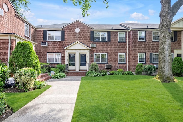 69-29 210th St Unit A, Bayside, NY 11364 - view of front of property featuring brick siding and a front yard