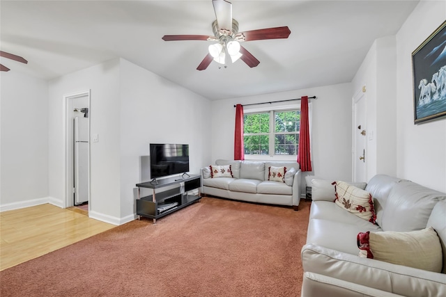 69-29 210th St Unit A, Bayside, NY 11364 - living area featuring a ceiling fan, light carpet, baseboards, and light wood-style flooring