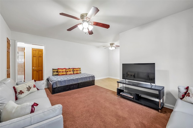 69-29 210th St Unit A, Bayside, NY 11364 - carpeted living room featuring a ceiling fan and baseboards