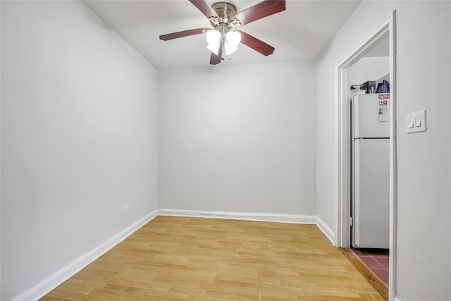 69-29 210th St Unit A, Bayside, NY 11364 - empty room with a ceiling fan, light wood finished floors, and baseboards