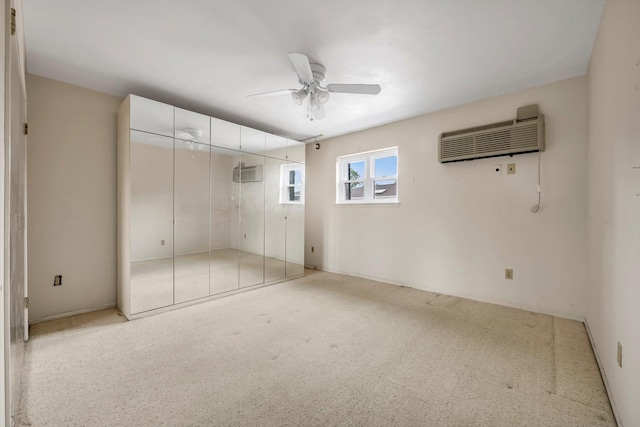 1337 Broadway Unit D20, Hewlett, NY 11557 - unfurnished bedroom featuring a wall unit AC, light colored carpet, a closet, and ceiling fan