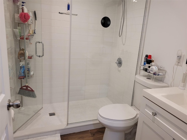 3039 Fulton St, Brooklyn, NY 11208 - full bathroom featuring a shower stall, vanity, toilet, and wood finished floors