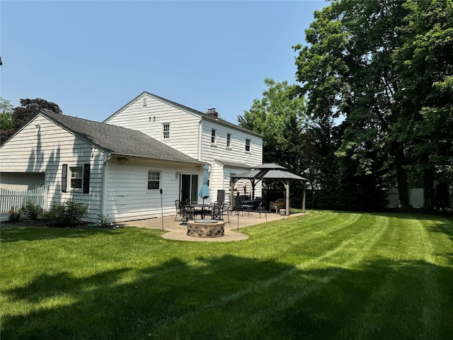 7 Yorkshire Ave, Stony Brook, NY 11790 - rear view of property with a gazebo, a patio area, a chimney, and roof with shingles