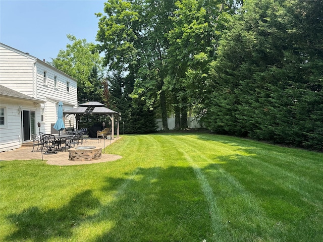 7 Yorkshire Ave, Stony Brook, NY 11790 - view of green lawn with a gazebo, an outdoor fire pit, and a patio