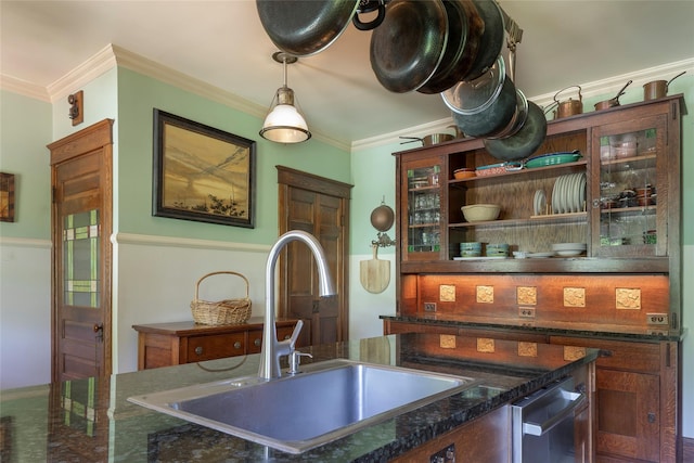 8 Elmer Galloway Rd, Katonah, NY 10536 - kitchen with crown molding, decorative light fixtures, dark stone counters, and glass insert cabinets