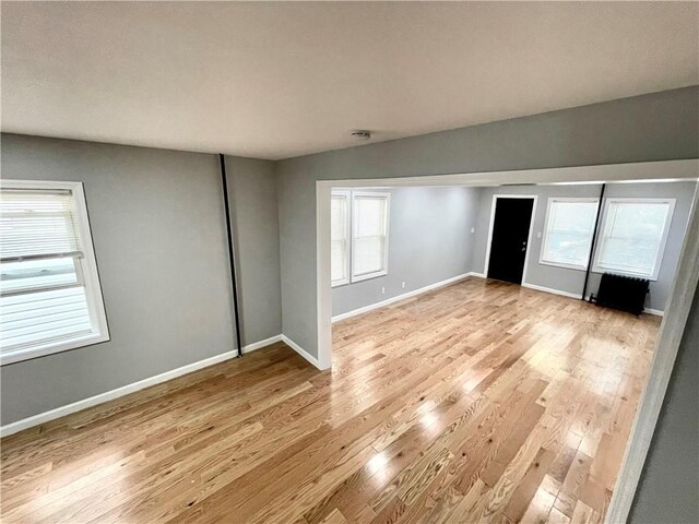 1231 E 88th St, Brooklyn, NY 11236 - unfurnished room with light wood-style floors and baseboards