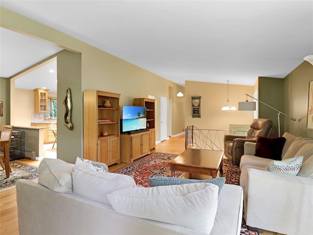 2 Hedge Row, New City, NY 10956 - living room with light wood-style floors, vaulted ceiling, and baseboard heating