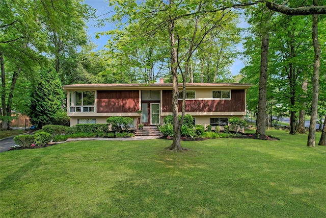 2 Hedge Row, New City, NY 10956 - bi-level home featuring a front lawn and a chimney