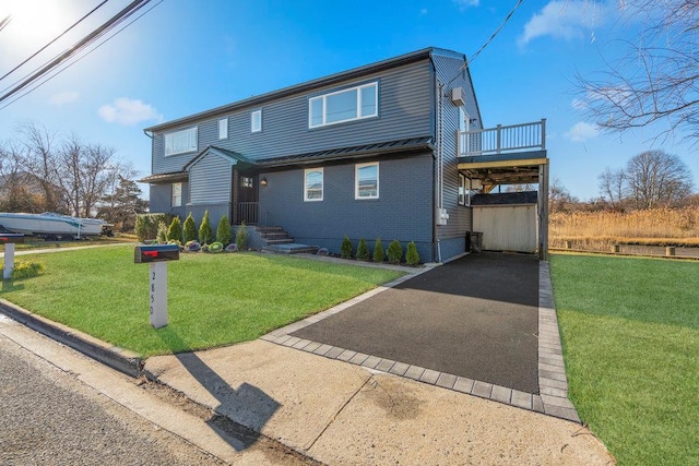 2850 Shore Rd, Seaford, NY 11783 - view of front of house with driveway, a front yard, and brick siding