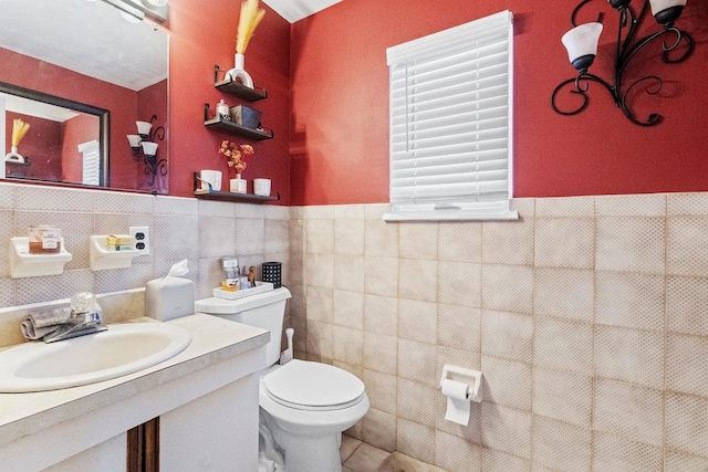 2850 Shore Rd, Seaford, NY 11783 - half bath with toilet, tile walls, vanity, and a wainscoted wall