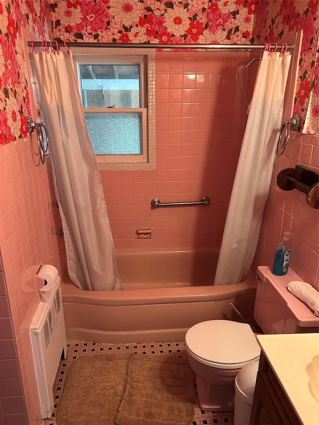 21 Stillman Rd, Glen Cove, NY 11542 - bathroom featuring wallpapered walls, tile walls, vanity, toilet, and shower / tub combo